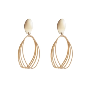 Minimalist gold geometric dangle earrings featuring layered oval rings on white background