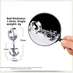 Detailed view of silver anchor earring with 1.2mm gauge and dimensions on ruler