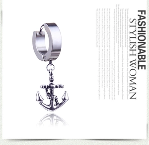 Detailed close-up of a stainless steel anchor earring with a sharp mirror reflection