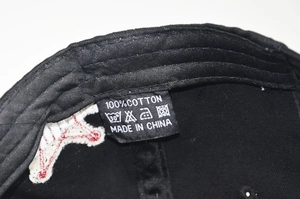 Detail of the 100% cotton washing label and inner stitching on the Rules 1923 baseball cap