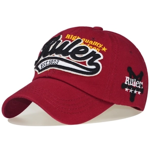 Detailed close-up of 3D embroidery and high quality stitching on burgundy cotton cap