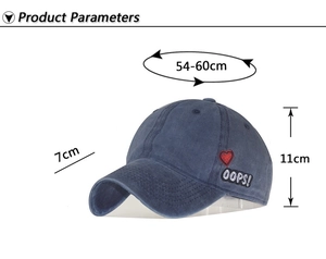 Detail of washed cotton baseball cap with heart embroidery and size specifications