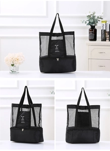 Detailed view of black dual-layer picnic bag with mesh top and insulated base compartment