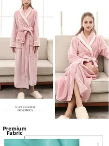 Detail of pink fleece bathrobe showing contrast lapel, large pockets and soft fabric texture