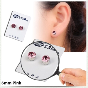 Detailed view of 6mm pink magnetic stud earrings with faceted crystal and card packaging