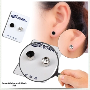 Close-up of 6mm black and white magnetic stud earrings set for non-pierced ears