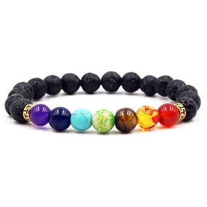 7 Chakra lava stone beaded bracelet with colorful gemstones and golden spacers on white