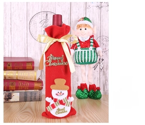 Detailed view of red Christmas wine bottle cover with snowman applique and gold ribbon bow