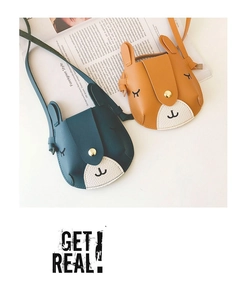Detail of cute animal-themed mini purses for girls with metallic snap closure and slim straps