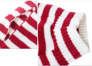 Detail view of red and white striped knit sweater showing ribbed cuffs and precise openings