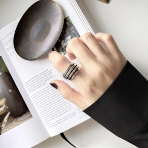 Detail of a multi-layer 925 sterling silver ring with minimalist vintage wire design
