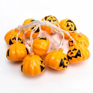 Halloween LED pumpkin string lights with jack-o-lantern faces and battery box on white background
