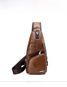 Detail view of brown lychee-patterned leather chest bag with zipper and metal logo