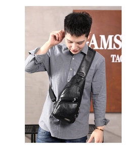 Detailed view of black faux leather crossbody chest bag for men with USB charging port