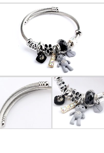 Detail of silver bear pendant charm bracelet with adjustable stainless steel wire mesh