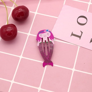 Detail shot of mermaid cartoon metal hair clip with purple and pink painted finish
