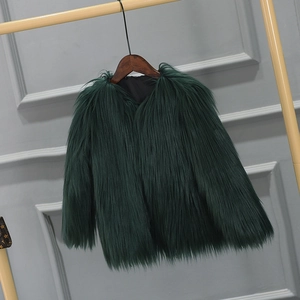 Detail of forest green faux fur texture on long-haired girls winter coat