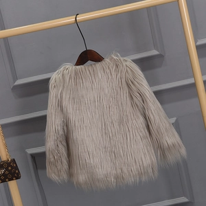 Detail of gray-brown faux fur girls winter jacket with plush texture and round neckline