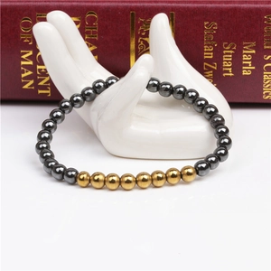 Detail of 6mm magnetic hematite beads bracelet on a white ceramic hand model
