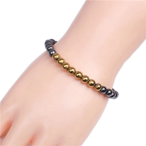 6mm magnetic hematite bracelet featuring gold and dark grey metallic round beads