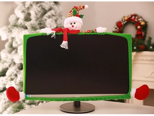Detail of green plush Christmas monitor cover with 3D snowman doll and festive design