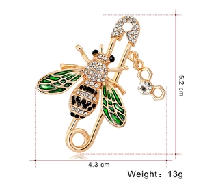Detail of bee brooch with green enamel wings and crystal honeycomb pendant, 5.2x4.3cm