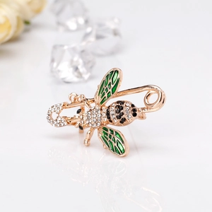 Fashionable gold bee brooch pin with sparkling rhinestones and green enamel wings