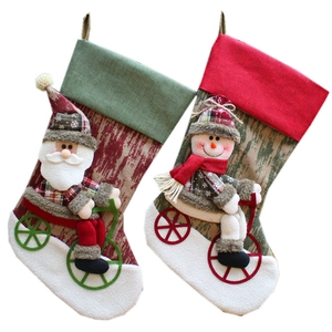 Christmas stockings set with Santa and Snowman on bicycles made of plush velvet fabric
