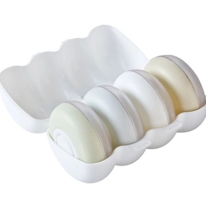 Travel makeup sponge set with 4 sponges in a portable white flip-top storage box