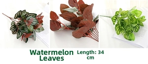 Detail view of 34cm artificial watermelon leaves in three colors for wedding decoration