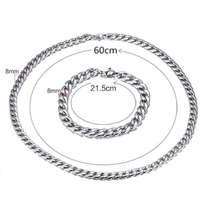 Flat lay of 8mm silver Cuban link chain set showing 60cm necklace and 21.5cm bracelet