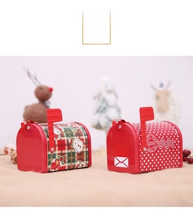 Close-up of Santa Mail tin mailbox with snowman patterns for Christmas candy storage
