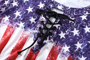 Close-up of the lace-up V-neckline and USA flag print on a women's casual knit top