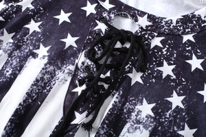 Detailed view of the lace-up V-neckline with metal eyelets and star-spangled flag print