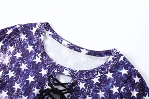 Detail of round neckline with black drawstring tie on purple star pattern t-shirt