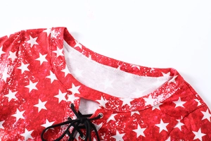 Detail of red V-neck top with white stars pattern and adjustable black drawstring lace-up