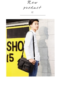 Outdoor shot of men black canvas crossbody bag with multiple pockets and adjustable strap