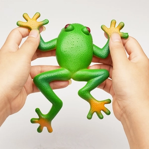 Realistic green soft rubber squeeze frog toy showing high elasticity and skin texture