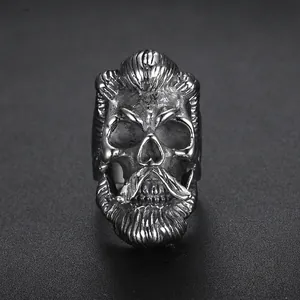 Vintage stainless steel skull ring with punk barber design and aged silver finish