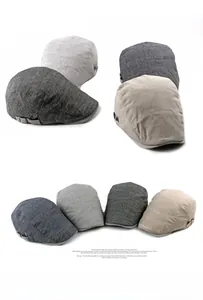 Detailed view of breathable linen beret hats in gray and beige with metal side buckles