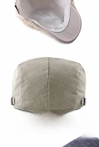 Detail of linen stripe flat cap showing breathable inner lining and adjustable back buckle