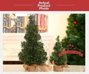 Detail of 20cm mini Christmas trees with burlap bases on a cozy indoor tabletop