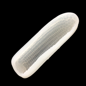 Detail showing 3D corn-shaped silicone mold texture for mousse cake on black background