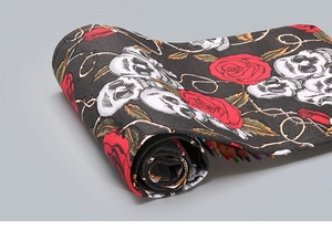Roll-up canvas pencil case featuring white skulls and red roses on black fabric