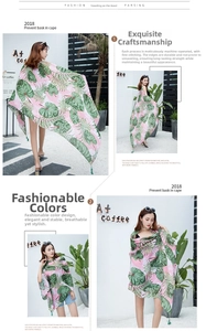 Detail of tropical palm leaf print on lightweight pink cotton linen beach shawl wrap