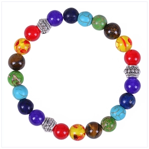Macro detail of 8mm seven chakra natural stone beads with silver-tone alloy spacers