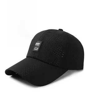 Close-up of black breathable mesh baseball cap with rectangular TUTUPAI LUCK brand patch