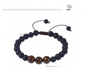 Detail of 8mm volcanic lava and tiger eye stone beads with adjustable braided cord