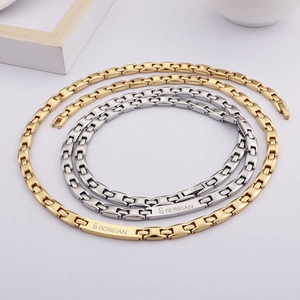 Matching gold and silver stainless steel bar necklaces with minimalist engraving
