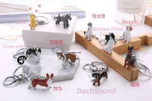 Collection of creative dog breed keychains including Corgi and Golden Retriever